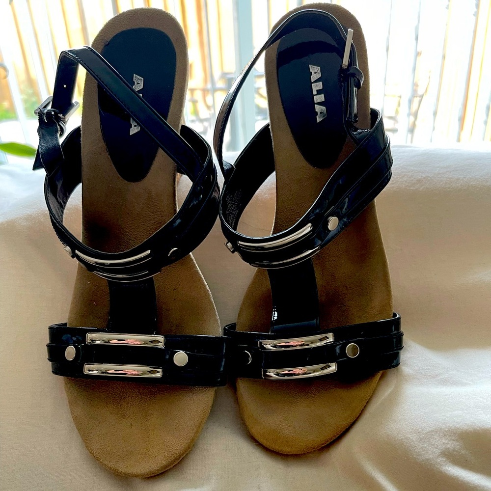 Alia, wedge-heeled sandals. Black patent with silver-coloured detail. Size 11M